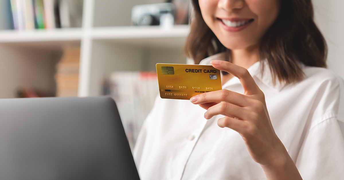 woman using a credit card for online purchase