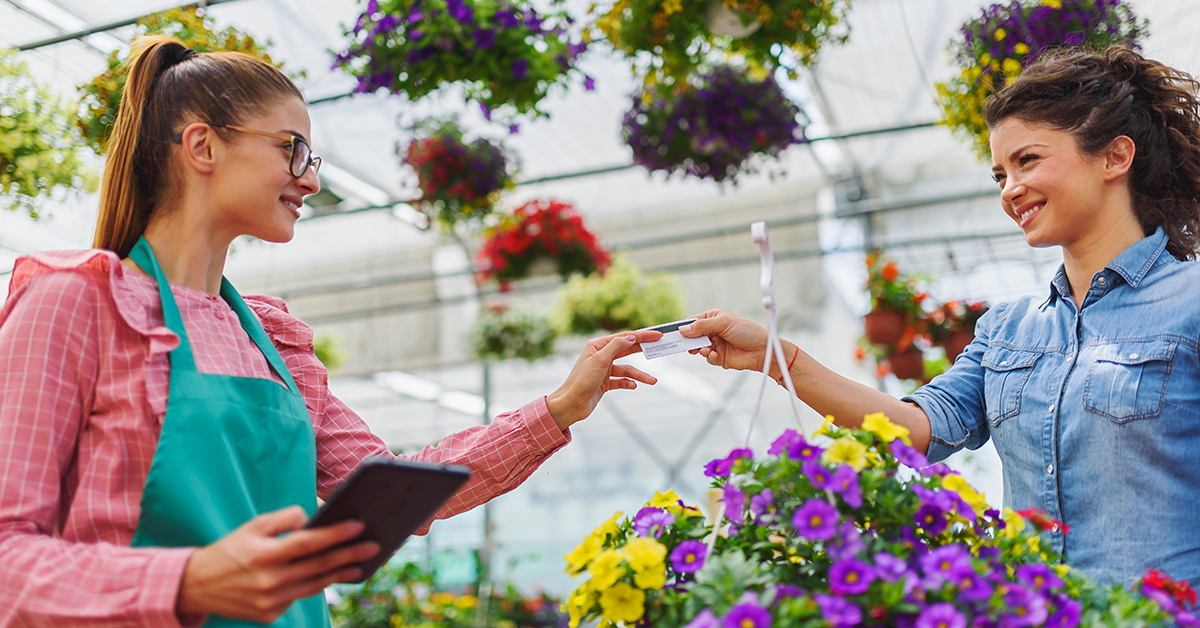 woman buying plants at a nursery