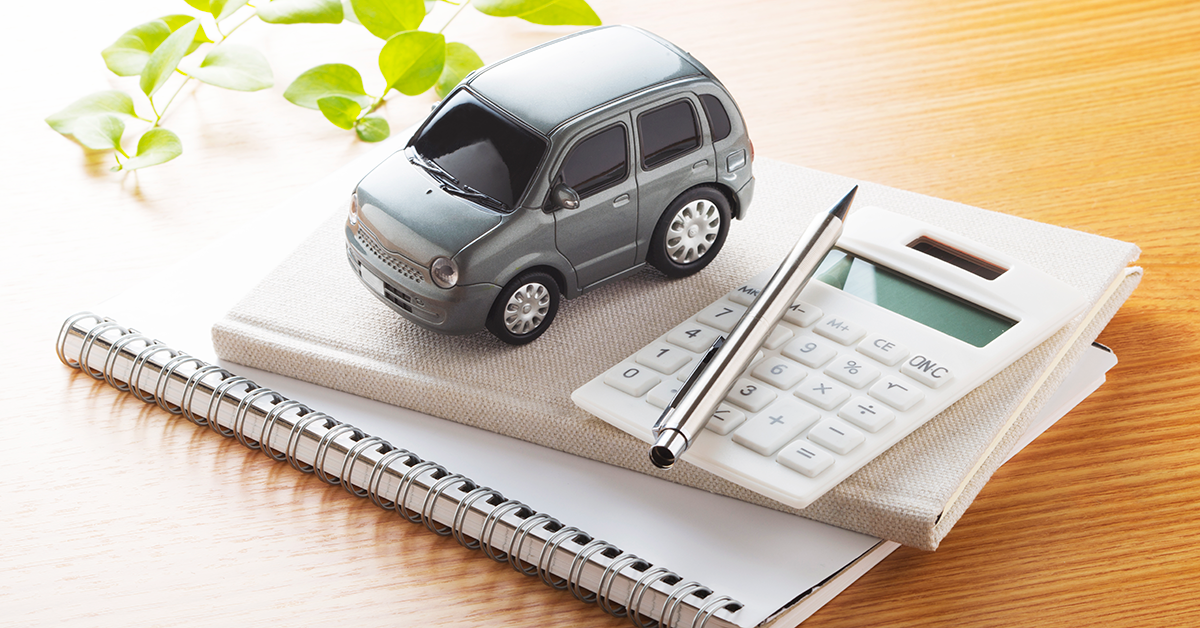 toy car and calculator on a notebook