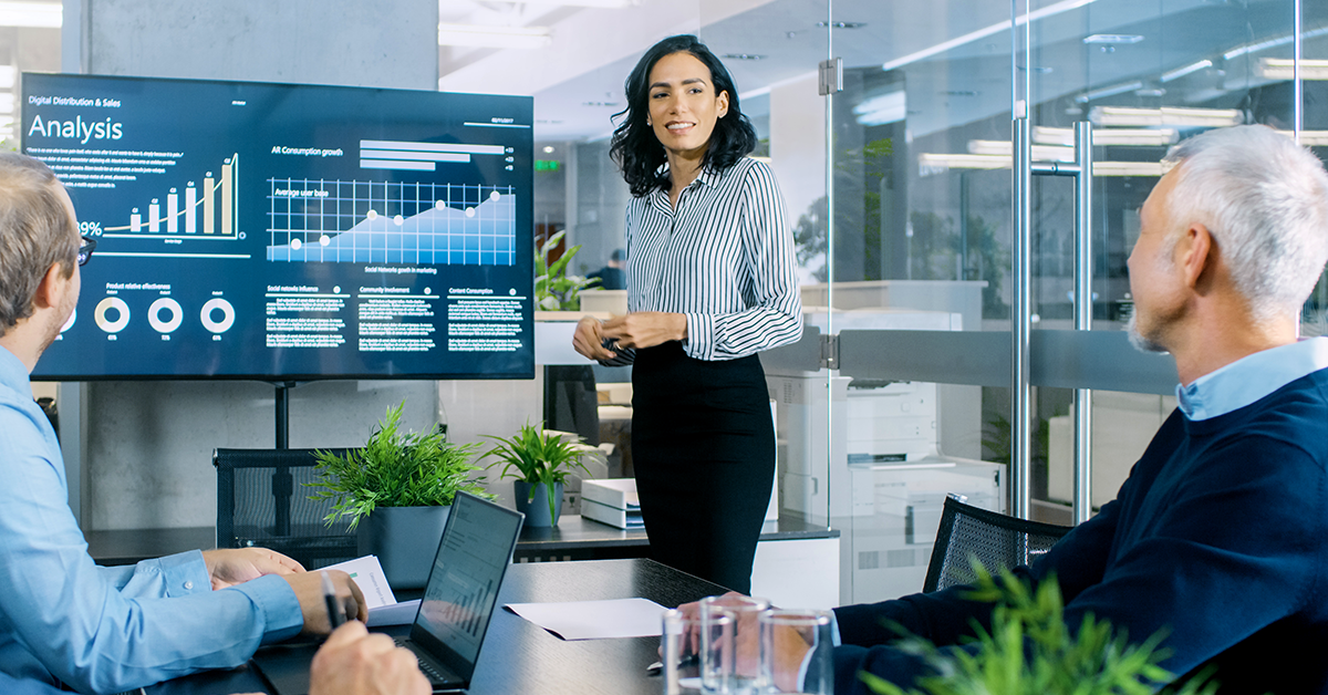 women presenting financials during a business meeting