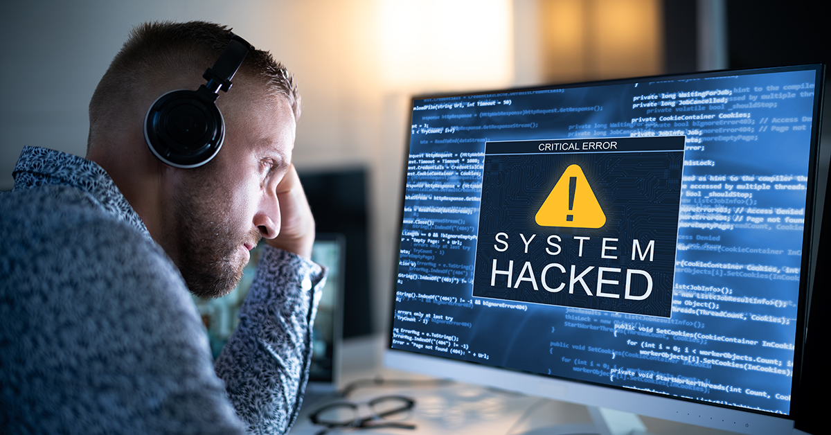 man finding out his computer has been hacked